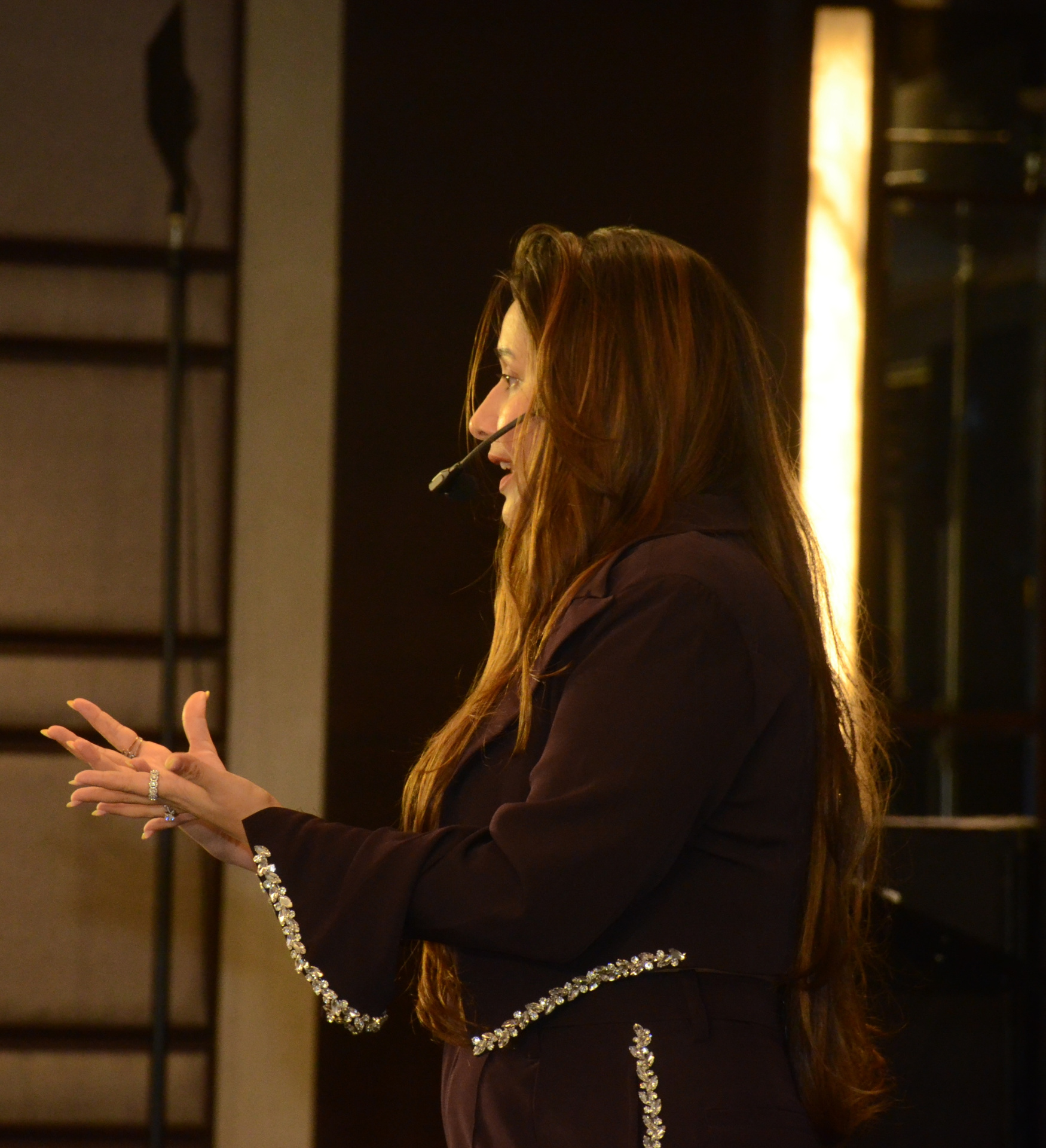 Aarzoo Shah speaking on stage